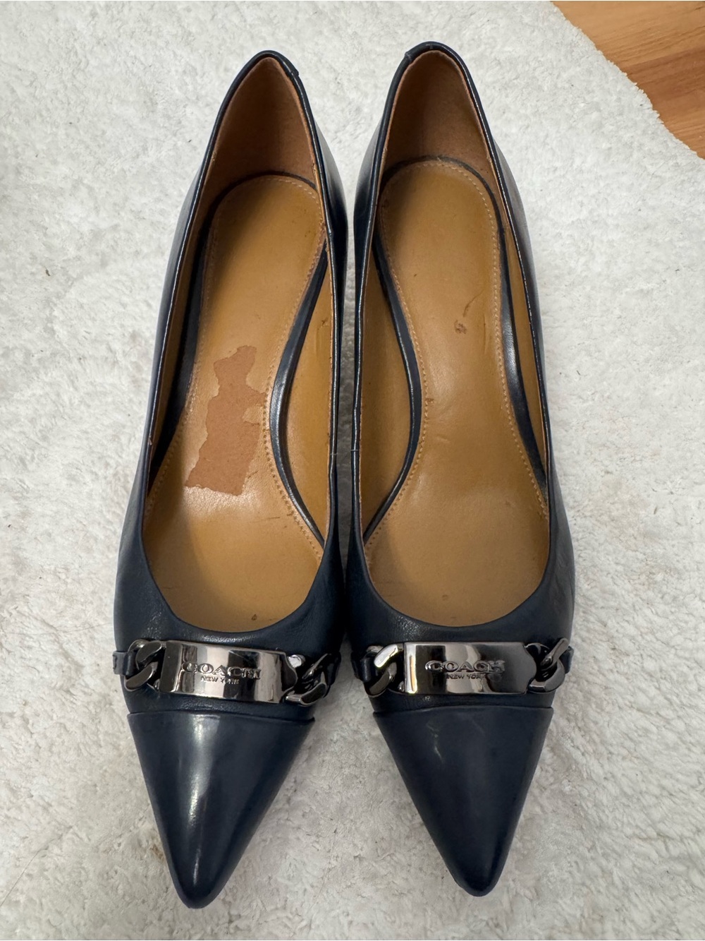 COACH Navy Pointed Toe Leather Flats with Silver Logo Plaque